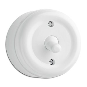 Vaihtokytkin (6), vipukytkimellä. Pinta-asennus, halk. 62mm, korkeus 49mm, IP20. Valkoinen bakeliitti.